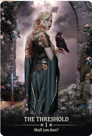 The Threshold card of the Dark Light Oracle deck shows a beautiful blonde woman in a green dress holding a raven. She is standing in a stone archway, there are skulls to her right and a sword pointed directly into the ground on her left. The sky is stormy and purple.